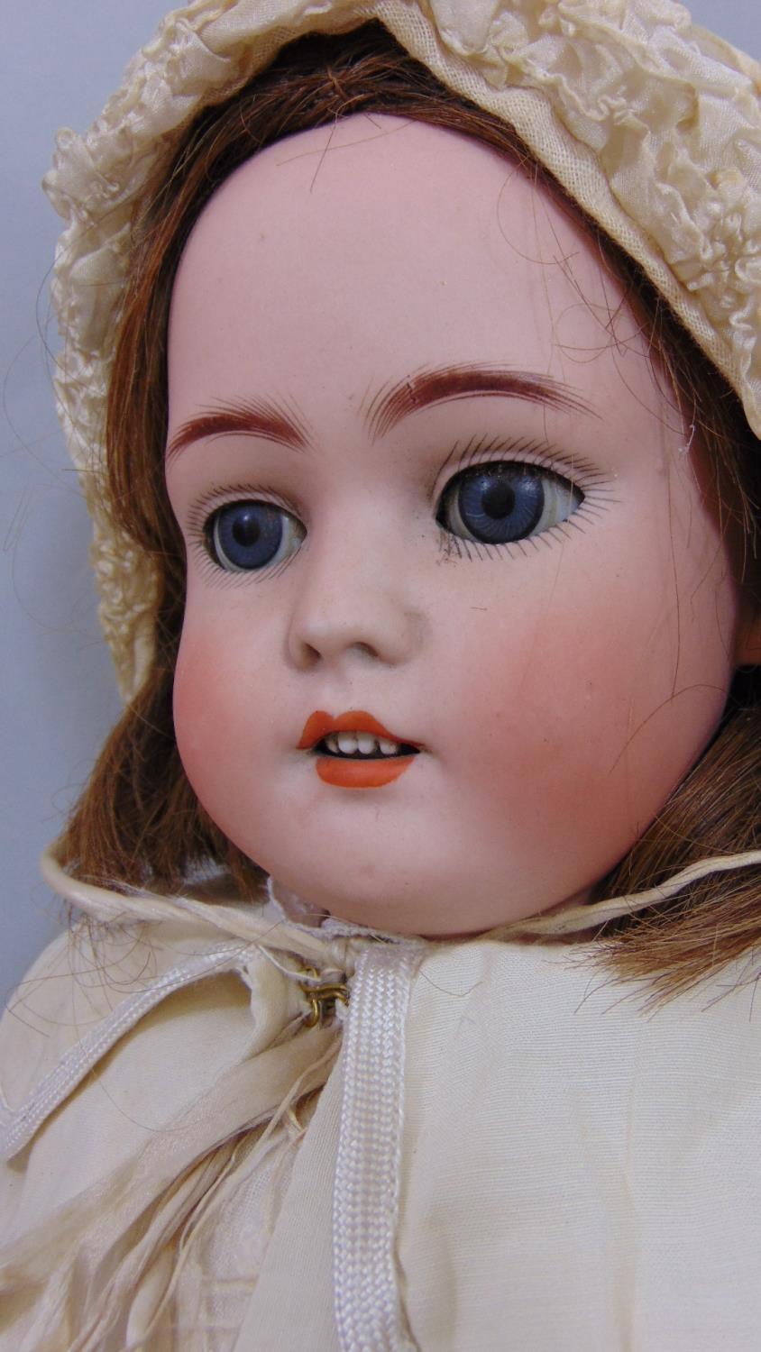 Doll by Simon & Halbig with bisque socket head with jointed pale coloured composition body. weighted - Image 2 of 5