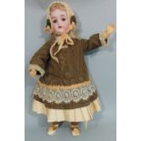 Bisque head doll by Kammer & Rheinhardt with composition jointed body, sleeping brown eyes,