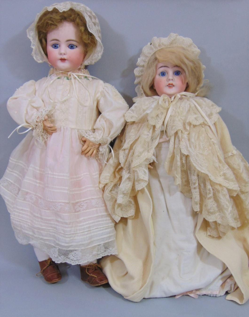 2 circa 1920's bisque head dolls both with jointed composition bodies, fixed blue eyes,open mouth