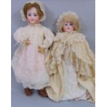2 circa 1920's bisque head dolls both with jointed composition bodies, fixed blue eyes,open mouth