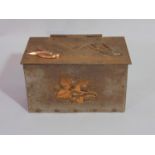 An Arts & Crafts steel casket with hinged lid and applied bird, foliate and berry detail, 19 cm long