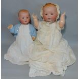 2 bisque head baby dolls Dream Babies both with composition bent limbs; the first has brown fixed