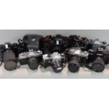 Box of manual 35mm SLR cameras to include Minolta, Pentax and Canon, most with prime and zoom lenses