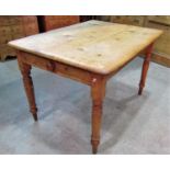 A Victorian stripped pine kitchen table of rectangular form with moulded outline, rounded corners