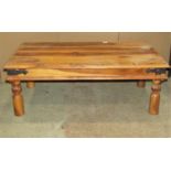 An Indian hardwood occasional table of rectangular form, with steel banded borders and stud detail