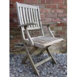A set of six weathered Westminster teak folding garden armchairs with slatted seats and backs