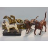 Pair of cast spelter studies of hounds, together with a further cast painted spelter study of a