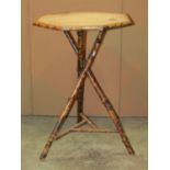 A late Victorian bamboo occasional table with octagonal top raised on cross legged tripod supports