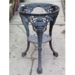 A cast iron Britannia head pub table with decorative pierced detail, (lacks circular top)