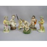 A collection of mainly 19th century Staffordshire type figure groups of cherubs including an early
