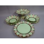 A decorative Plant Tuscan dessert service with alternating pale green, black and gilt panels