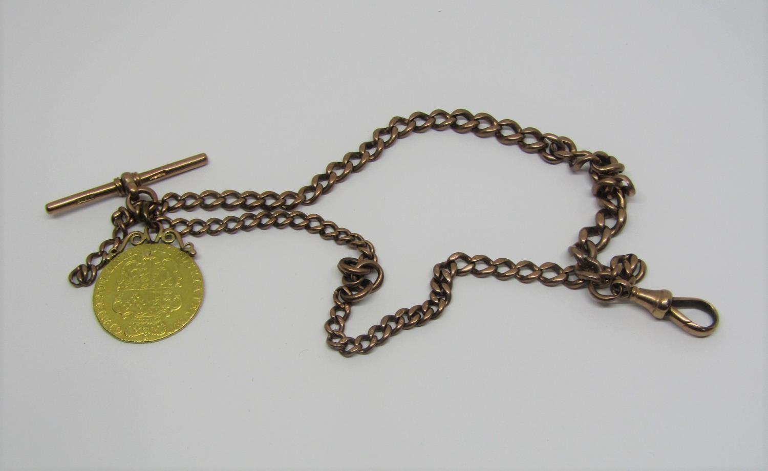 9ct Albert chain with T-bar, hung with a George III 1761 guinea, 38.5g