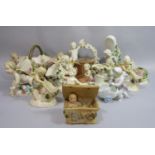 A collection of mainly late 19th century continental ornaments in the form of cherubs including a