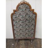 Substantial 19th century oak framed screen of half height with arched outline surmounted by a ribbon