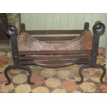 A good quality heavy Arts & Crafts style forge made fire basket and combined dogs with flattened