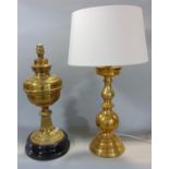 A brass oil lamp converted to electricity, 44 cm high, together with a further large brass table