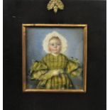 An early 19th century school three quarter length miniature portrait of a standing child in white