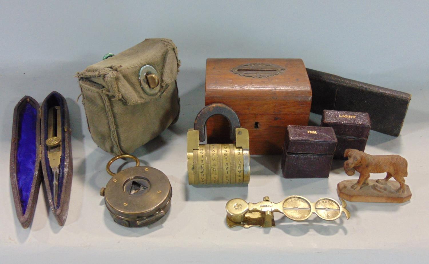 A mixed lot comprising an unusual old brass padlock with four letter combination, a leather cased