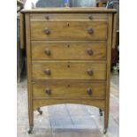 An unusual mid 19th century mahogany cabinet of four long graduated drawers, cedar lined and