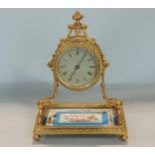 Pretty French boudoir clock with 2.5 inch silvered dial upon a scrolled Rococo type gilt cast