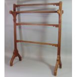 A late Victorian gothic revival freestanding towel rail with chamfered frame, 72 cm wide x 30 cm