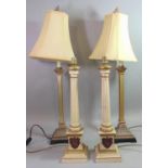Pair of painted Corinthian column table lamps with gilt highlights and crests to the stepped