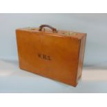 A good quality vintage leather dressing case, enclosing a black leather interior with various