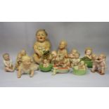 A collection of late 19th century and early 20th century continental bisque figures of the piano