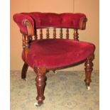 A Victorian library chair with upholstered seat and buttoned horseshoe shaped back rail
