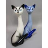 Two Sylvac models of seated Siamese cats with elongated necks, both with impressed numbers to base