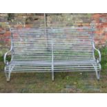 A sprung galvanised steel garden bench with scrolled back, arms and strap work seat, 6ft long