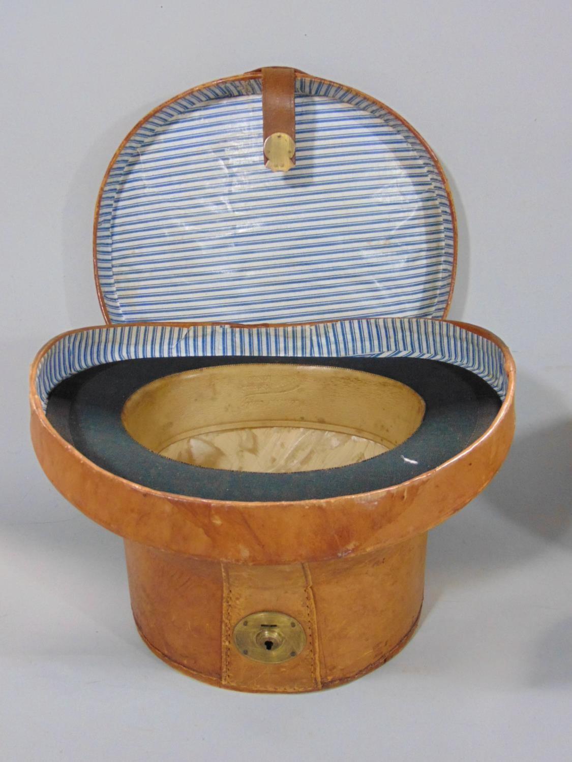 Leather hat box containing brushed silk black top hat by Henry Heath (internal circumference 57cm) - Image 2 of 3