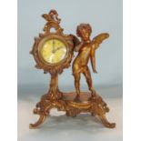 Continental gilt cast metal boudoir clock in the Rococo manner, fitted with a two inch dial upon a