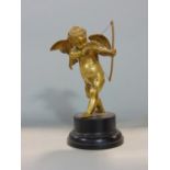 Ormolu/gilt bronze study of a standing cupid upon a stepped circular wooden plinth marble base, 20