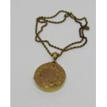 9ct circular locket with engraved floral garland, hung on an associated antique 15ct rope twist