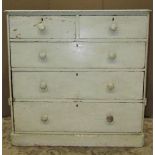 A Victorian pine bedroom chest of two short over three long graduated drawers with later painted