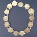A necklace constructed from early English coinage, Elizabeth 1st sixpence 1575 and 13 x Queen