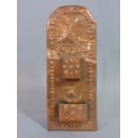 A Newlyn School Arts & Crafts copper wall mounted Matchbox/vesta holder, the arched back plate