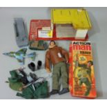 Boxed Action Man soldier with gripping hands and rifle, a similar unboxed Action Man, accessories