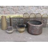 Two small folding brass framed fire guards of varying design together with a brass coal hod, coal