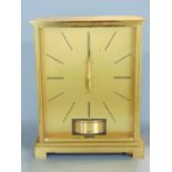 Jaeger Le Coultre brass cased Atmos clock with red glass sides, 22 cm high