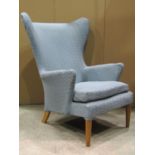 A vintage Parker Knoll wing armchair model number 757/8/9/60