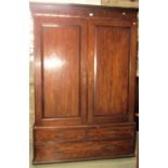 A Georgian mahogany hanging cupboard, the upper section enclosed by a pair of fielded panelled doors