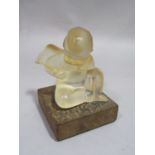 Early 20th century Lalique study of a seated putti/cherub, 8 cm high