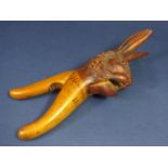 A Danish carved softwood nutcracker in the form of a hare's head, ears erect - Himmelbjerget 1923,