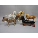 A Hutschenreuther model of a grey foal, two further models of horses, a Beswick Dachshund and a