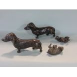 Two pairs of bronze dogs to include a pair of standing daschunds 20 cm long and two further hounds