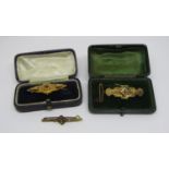 Three antique gold brooches; a 15ct floral example and two further 9ct mourning examples, 7.7g gross