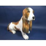 An Italian model of a seated Bassett hound with painted mark to base, 45cm tall