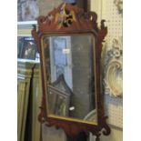 A Chippendale style wall mirror with gilt painted slip, fret carved frame and gilt ho-ho bird